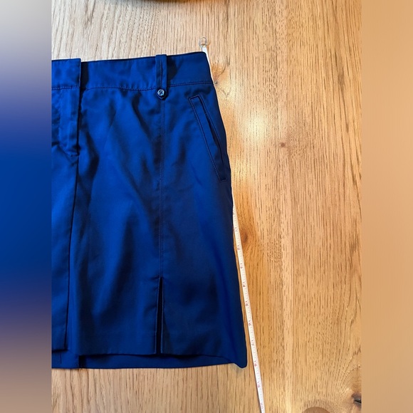 Izod Womens Skort Navy Blue Pockets Golf  Solid Zip Button Front Pleated Hem - Picture 9 of 9